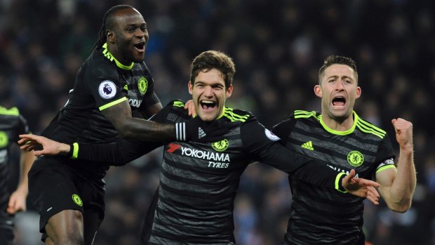 Surprise star: Chelsea's Marcos Alonso celebrates one his two goals against Leicester.