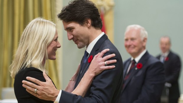 Canadian Prime Minister Justin Trudeau hugs Environment and Climate Change Minister Catherine McKenna after the new cabinet took the oath of office at Rideau Hall, the governor-general's residence, in Ottawa on November 4.