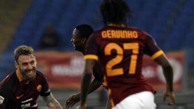 Roma's Sadiq Umar, centre, celebrates past teammates Daniele De Rossi, left, and Gervinho.