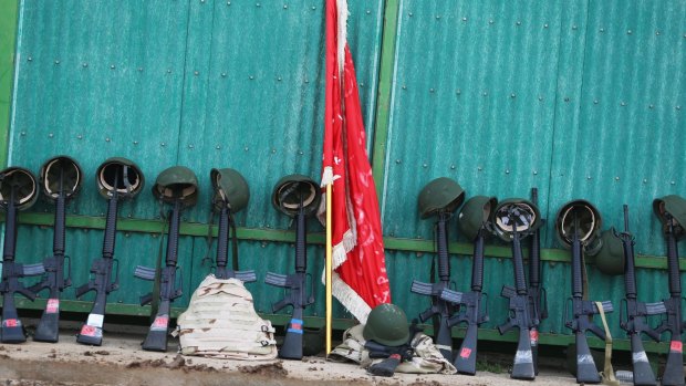 M16 rifles and helmets from the Iraq Security Forces Ninewa Operations Command-NOC-Commando Battalion at the rifle range. 