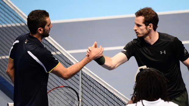 Marin Cilic and Andy Murray shake hands after their match.