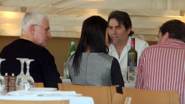 Ron Medich, left, at lunch with Lucky Gattellari, on phone, in September 2009.