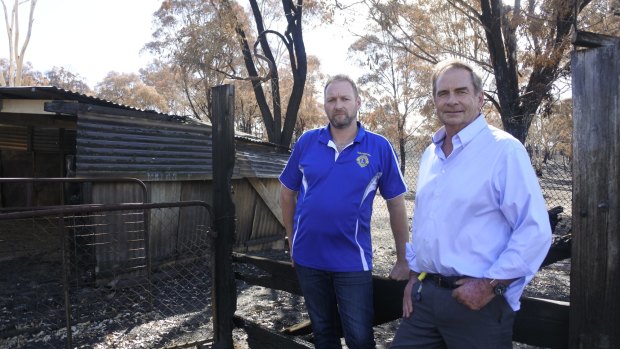 Queanbeyan Lions Club president Jamie Walker (left) has donated $20,000 on behalf of the club to the Queanbeyan-Palerang Regional Council's Carwoola Bushfire Appeal, organised by council administrator Tim Overall (right).