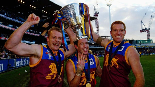 Michael Voss, Craig McCrae and Justin Leppitsch after the Lions' mighty AFL grand final win against Collingwood in 2003.
