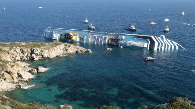 Luxury cruise ship Costa Concordia leans on its side after running aground in January 2012.