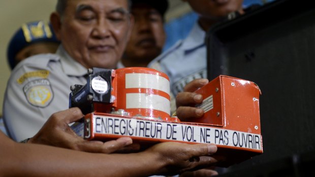 Head of Indonesian National Transportation Safety Committee Tatang Kurniadi shows the recovered Cockpit Voice Recorder.