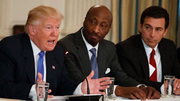 Donald Trump, left, meeting with manufacturing executives in February, including Merck's Kenneth Frazier, centre.