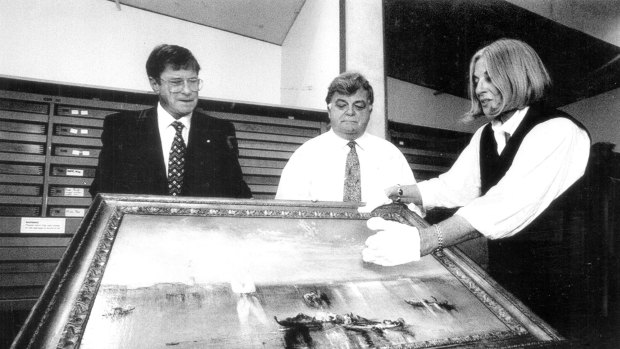 From left:  Gallery chairman Kerry Stokes, his deputy Brian Johns and director Betty Churcher examine Turner's Campo Santo Venice.