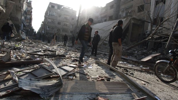 The aftermath of an air strike by forces loyal to the Syrian government in Duma, Damascus.