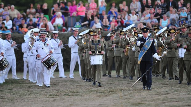 Canberra's Anzac centenary tribute began with a traditional beating retreat ceremony on the Patrick White Lawns in front of the National Library of Australia. 