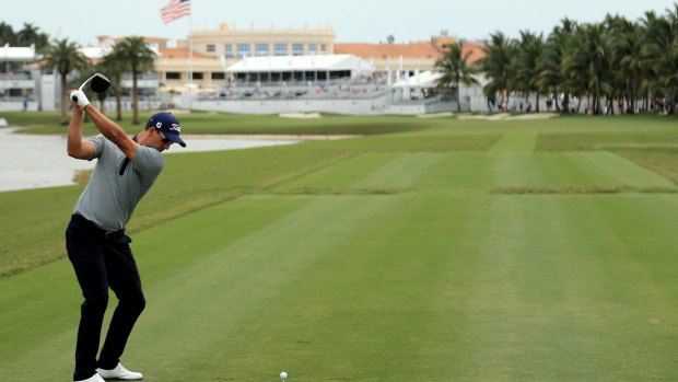 Tough day: Adam Scott on the final hole of round one at Trump National Doral Blue Monster Course in Florida.