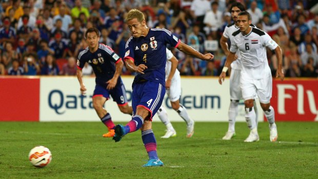 Keisuke Honda of Japan coverts a penalty against Iraq in Brisbane on Friday.