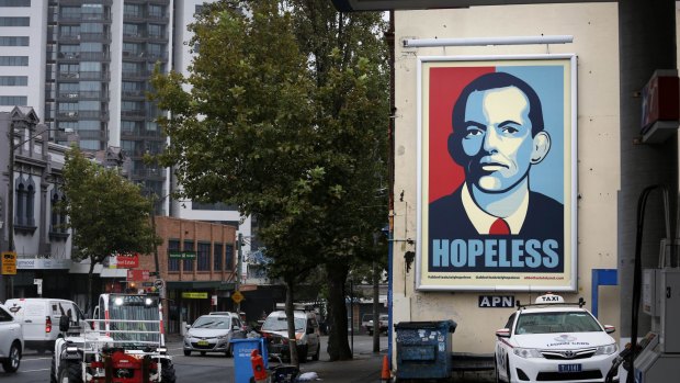 A Tony Abbott ''hopeless'' poster at a service station in Sydney.