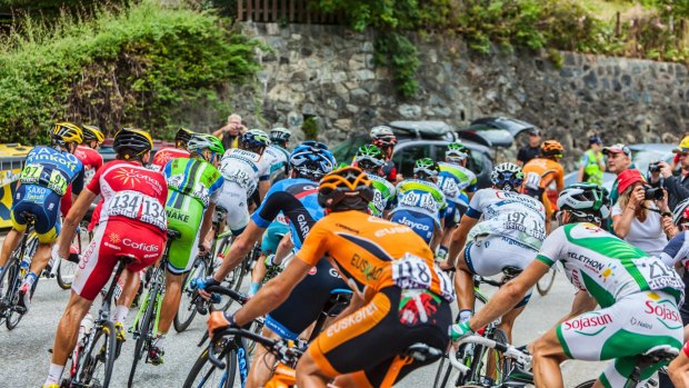 The peloton climbing the road to Alpe-D'Huez.
 