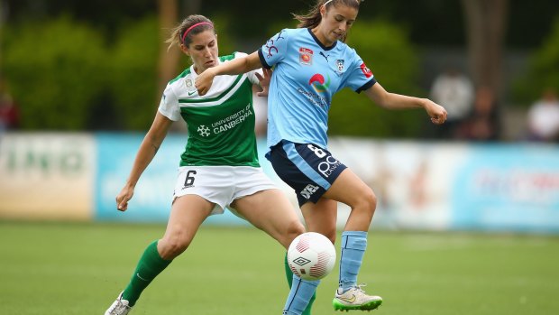 Caitlin Munoz competes with Amy Harrison of Sydney FC.