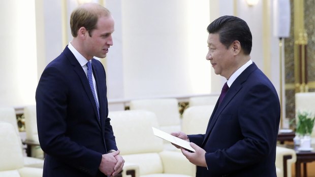 Prince William meets Chinese President Xi Jinping at the Great Hall of the People in Beijing on Monday.