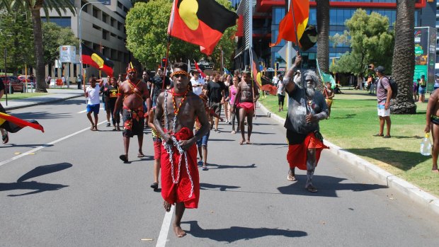 Hundreds of people have marched along Perth foreshore to protest the date Australia Day is held. 