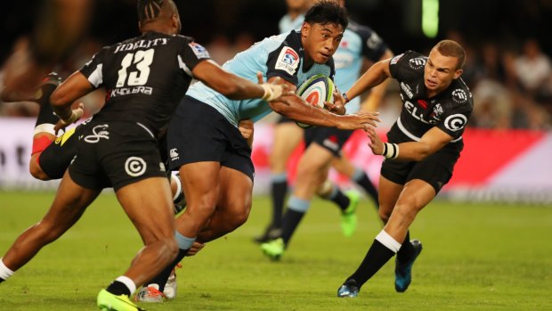 Irae Simone of the NSW Waratahs on the attack against the Sharks.