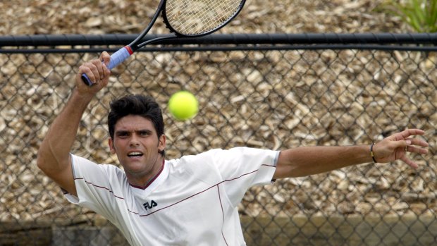 Mark Philippoussis practises at Kooyong in 2003.