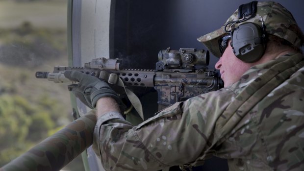 Captain Wales fires on a moving target range with Australian Special Air Service Regiment snipers as part of his Army secondment at Campbell Barracks Swanbourne, Perth. 