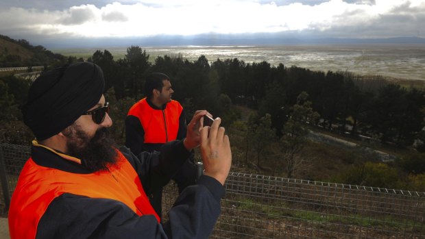 Truck driver Hardaypal Singh, left, and friend Reghav Sherme stop to take a photo at Lake George.