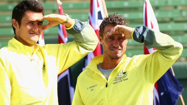 Bernard Tomic and Llewton Hewitt of Australia look on during the official draw on Thursday for the Davis Cup match against the US.