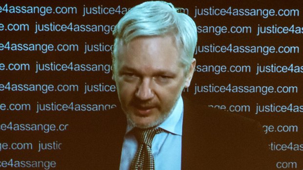 Julian Assange speaks at a press conference via a video link from the Ecuadorian Embassy in London on February 5, 2016. 