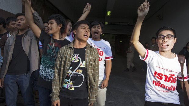 Friends of Patiwat Saraiyaem and Porntip Mankong react after the two were sentenced.