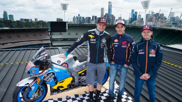 High in the saddle: MotoGP riders Marc Marquez, Jack Miller and Moto3 rider Brad Binder pose on top of the Melbourne Cricket Ground.