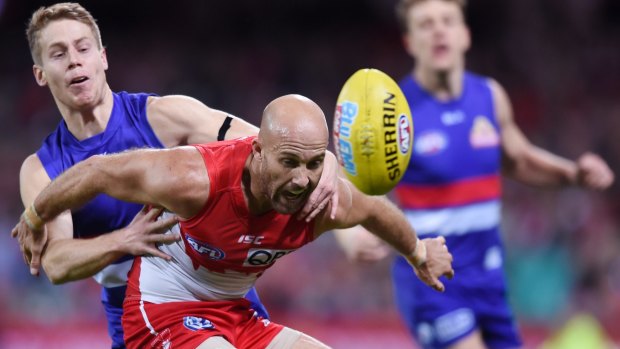 Interrupted season: Jarrad McVeigh competes for the ball with Lachie Hunter during the round 15 match between the Swans and the Bulldogs.