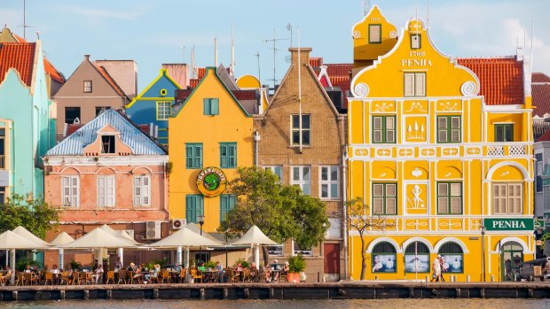Dutch architecture and cafes line the waterfont on the Punda side of Willemstad in Curacao.