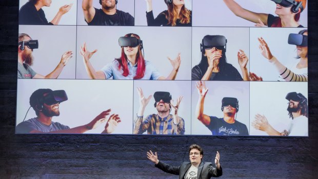 Palmer Luckey shows the numerous people will be using his headset.