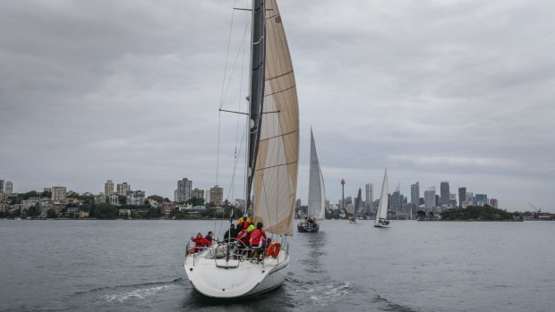 Yachts head for the finish line in the CYCA Twilight Series on Sydney Harbour.