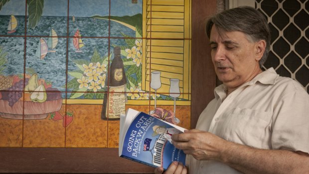 Ian McFadyen with a copy of the book he co-authored with Professor Ross Fitzgerald.