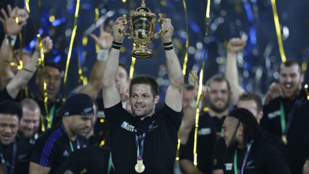 Winners: New Zealand's captain Richie McCaw holds up the World Cup.