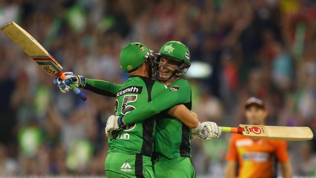 Peter Handscomb of the Melbourne Stars celebrates with team mate Scott Boland, after scoring the winning runs and a century.