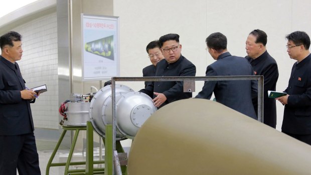 Image distributed on Sunday allegedly shows North Korean leader Kim Jong-un inspecting the loading of a hydrogen bomb into an intercontinental ballistic missile.