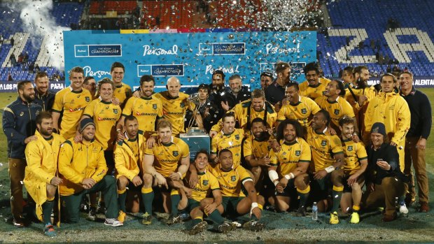 Winning feeling: The Wallabies pose for a photo after winning against Argentina.