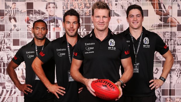 Collingwood coach Nathan Buckley (second from right) with new recruits (from left) Travis Varcoe, Levi Greenwood and Jack Crisp.