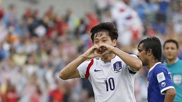 South Korea's Nam Tae-hee (L) celebrates his goal against Kuwait at Canberra stadium on January 13.