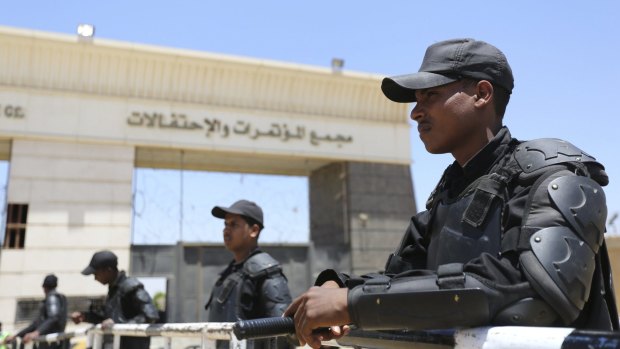 Policemen take their positions during the trial of ousted Egyptian president Mohamed Morsi.