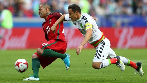 Portugal's Ricardo Quaresma (left) and Mexico's Andres Guardado battle for possession.