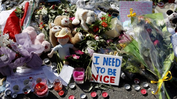 Flowers are placed at the scene of a truck attack on the famed Promenade des Anglais in Nice.