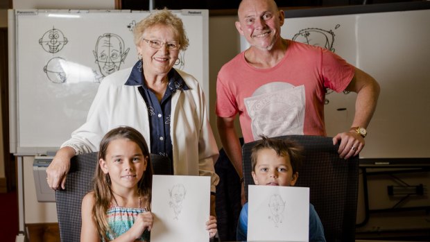 Colleen Kennedy, of Jervis Bay, and her grandchildren Caitlin Isbel, 9, and Thomas Isbel, 6, of Duffy, with Andrew Hore after taking part in his Cartooning Masterclass at Old Parliament House. 