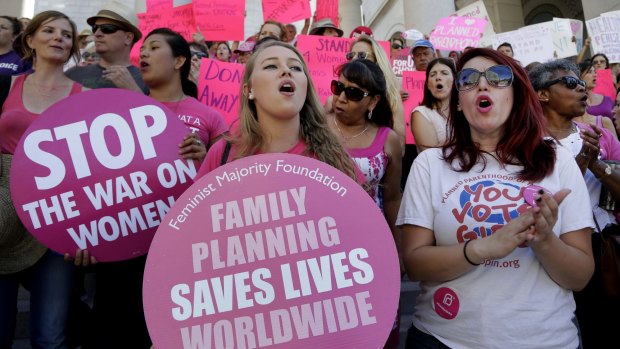Planned Parenthood supporters attend a September rally in Los Angeles to campaign for access to reproductive health care.