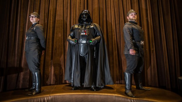 Canberra Star Wars fans and members of the 501st Legion prepping for the release of <i>Rogue One: A Star Wars Story</i> - Darth Vader (Jason Feldner), and imperial officers Tegan Smith and Matt Mulcahy. 