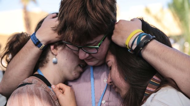 Environmental activists comfort each other during a protest against President-elect Donald Trump at the Climate Conference, known as COP22, in Marrakech, Morocco, on Wednesday.