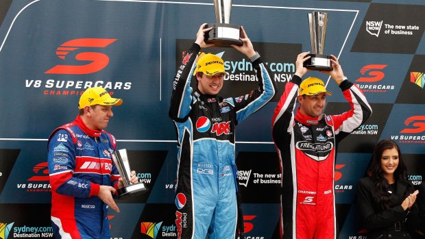 Jason Bright, Chaz Mostert and Fabian Coulthard celebrate on the podium.