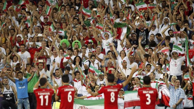 Great support: Iran players wave to fans after their Asian Cup Group C win over Qatar.