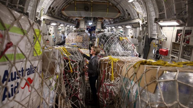 Onboard: Foreign Affairs Minister Julie Bishop inspects Australian aid supplies bound for Vanuatu.